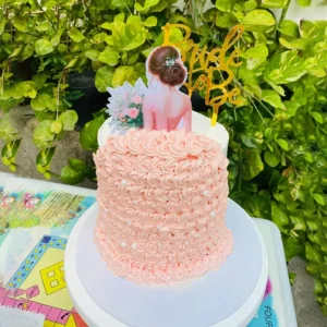 Two tier white anniversary cake with gold beads and gold Love topper